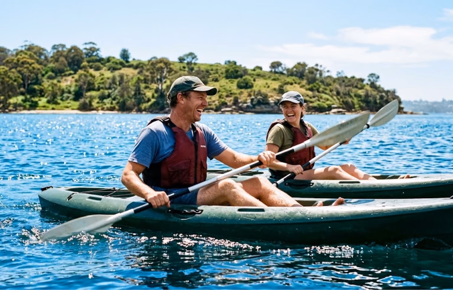 Two people paddling a kayak together on calm water
