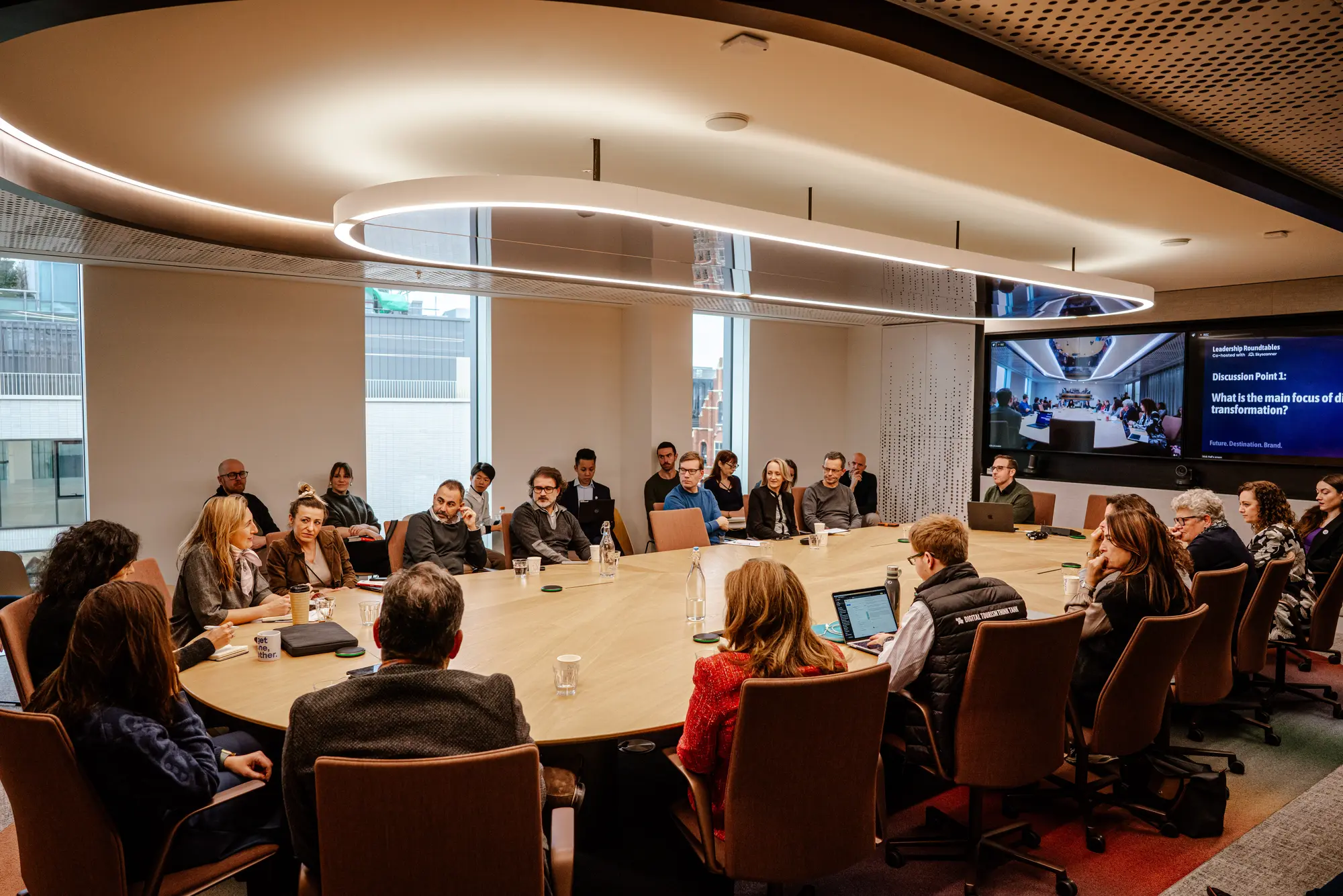 A destination leadership roundtable in session around a full table