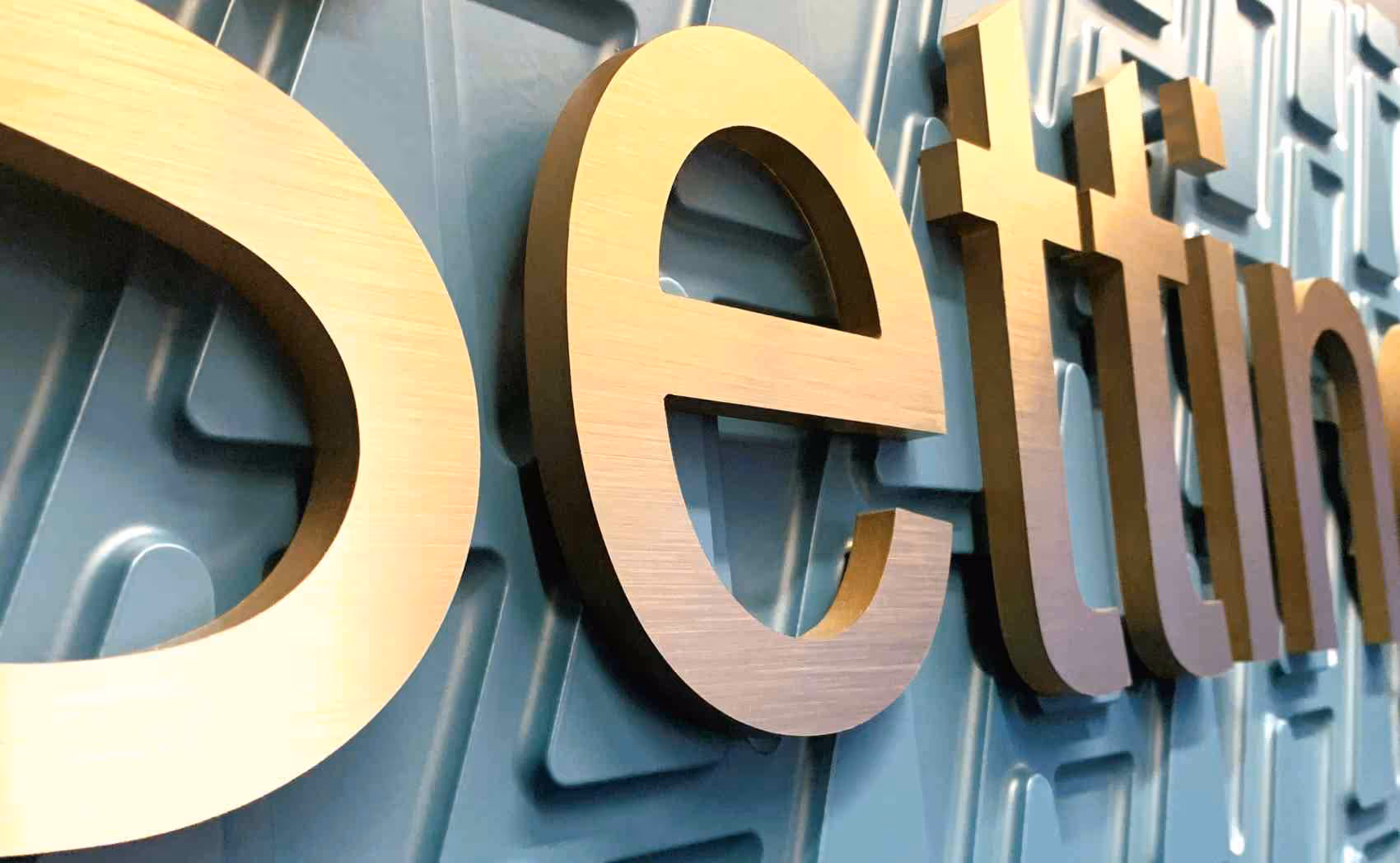 Gold-colored acrylic dimensional pin letters setting
