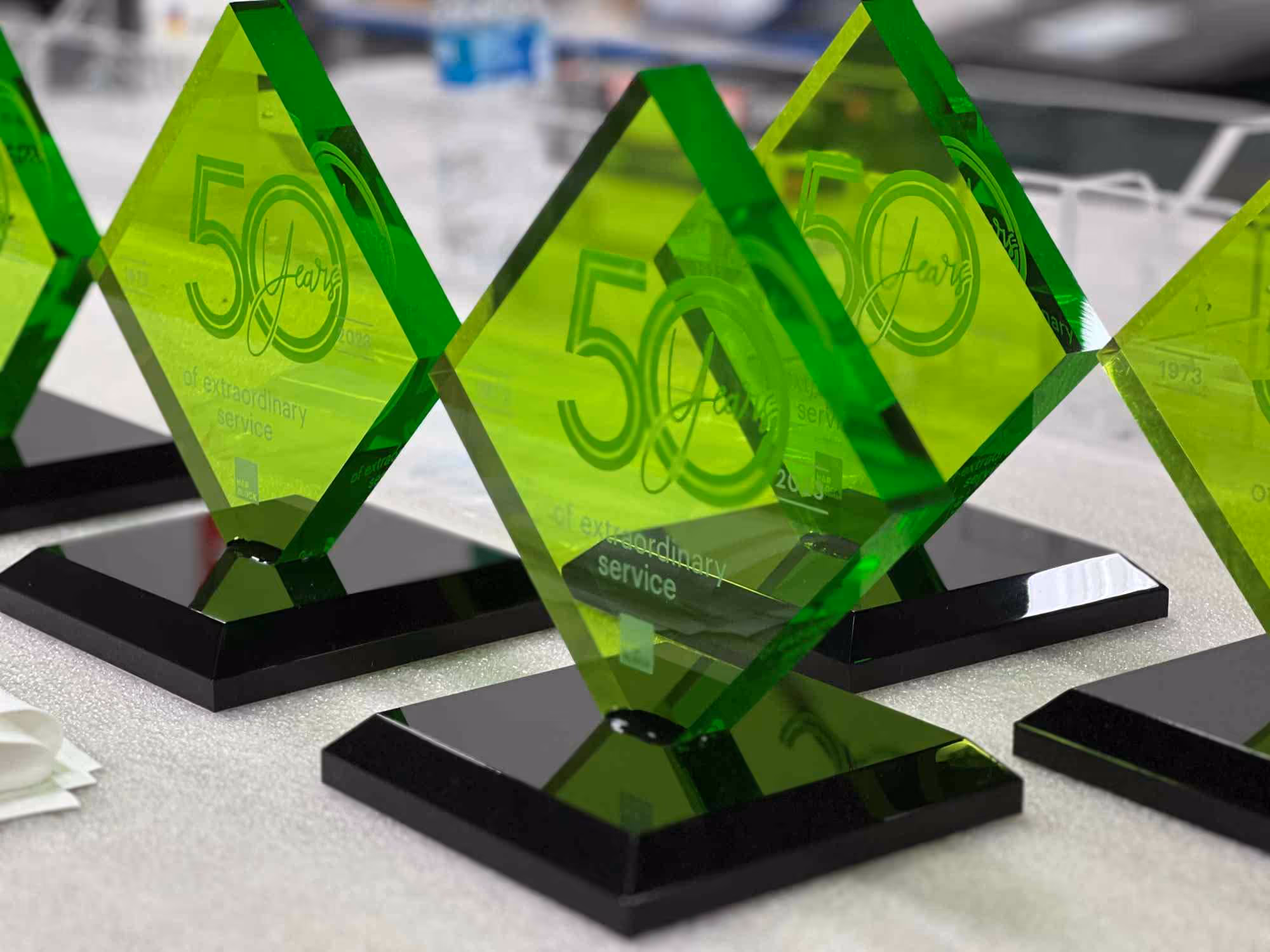 Custom acrylic service anniversary awards being produced with custom acrylic fabrication.