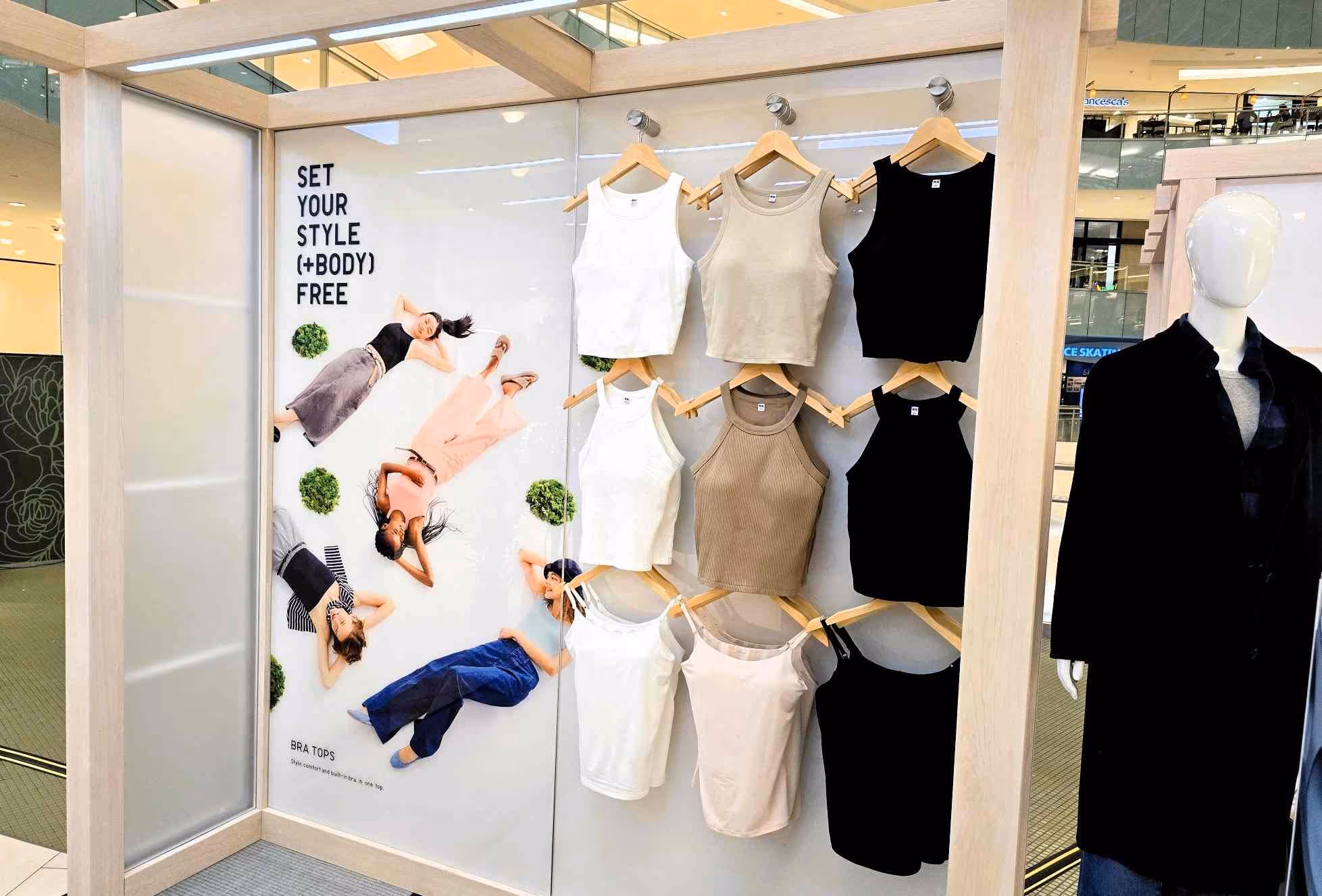 A Uniqlo pop-up display interior inside a shopping mall