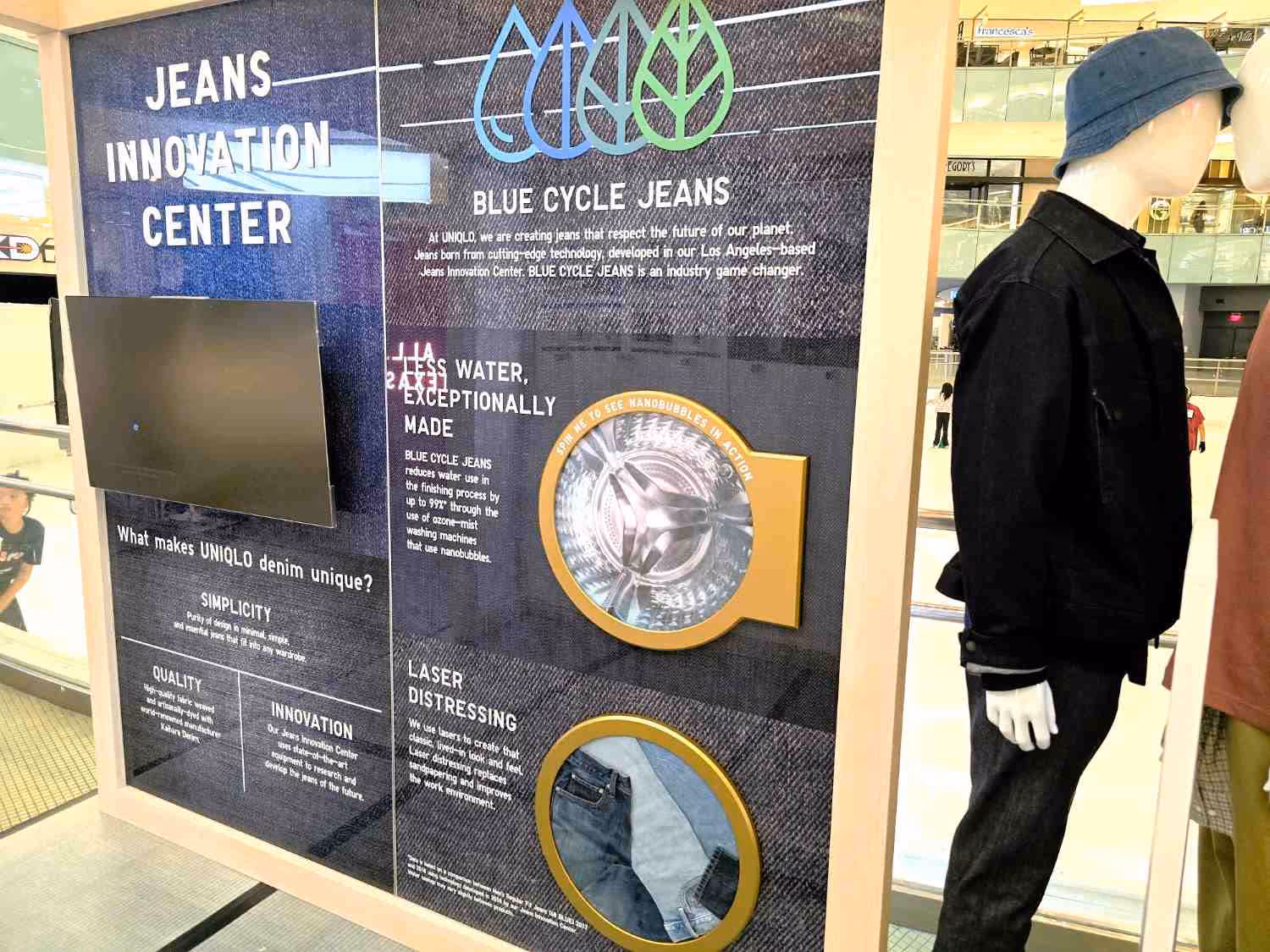 A Uniqlo pop-up retail display interior highlighting jeans.