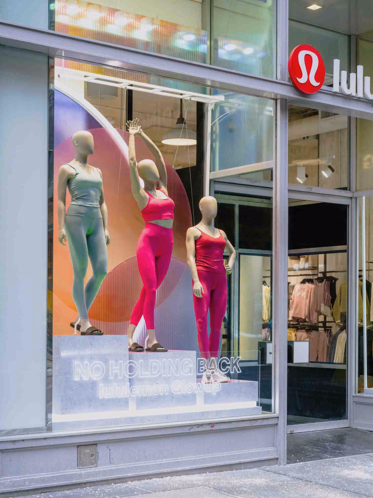 A custom retail window display in an apparel store, including custom acrylic fixtures made from recycled acrylic.