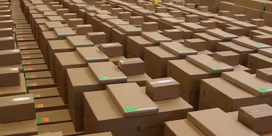 A large array of boxes within a warehouse.
