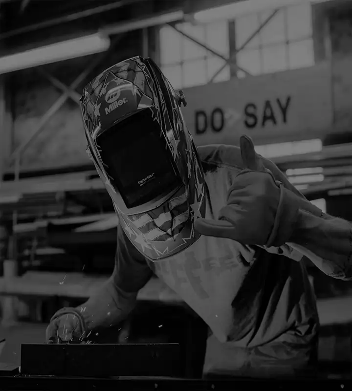 Welder wearing protective gear