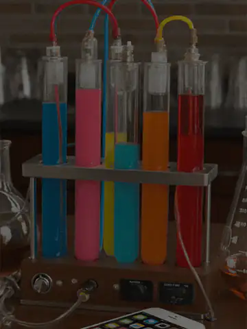test tubes being filled and drained with multiple colors of liquid