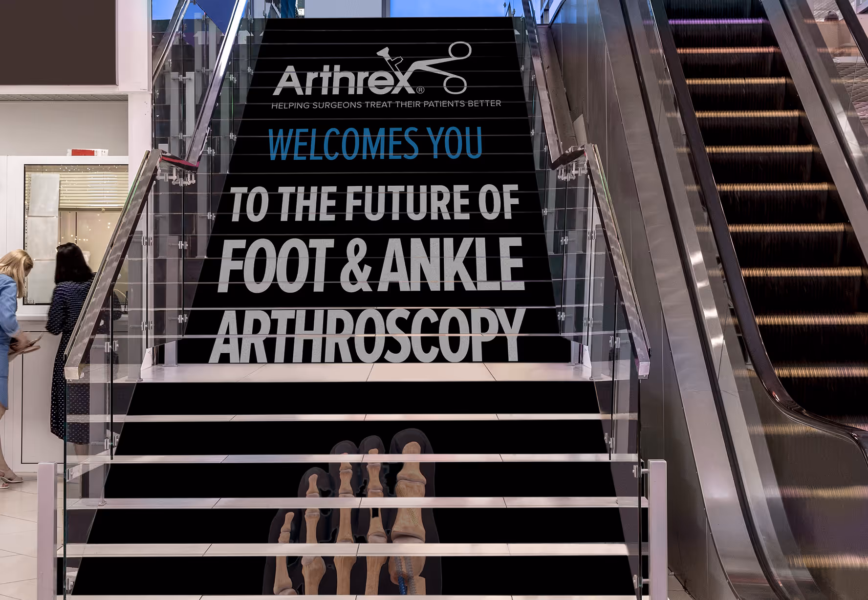 An escalator with a sign that reads, welcome to the future of foot.