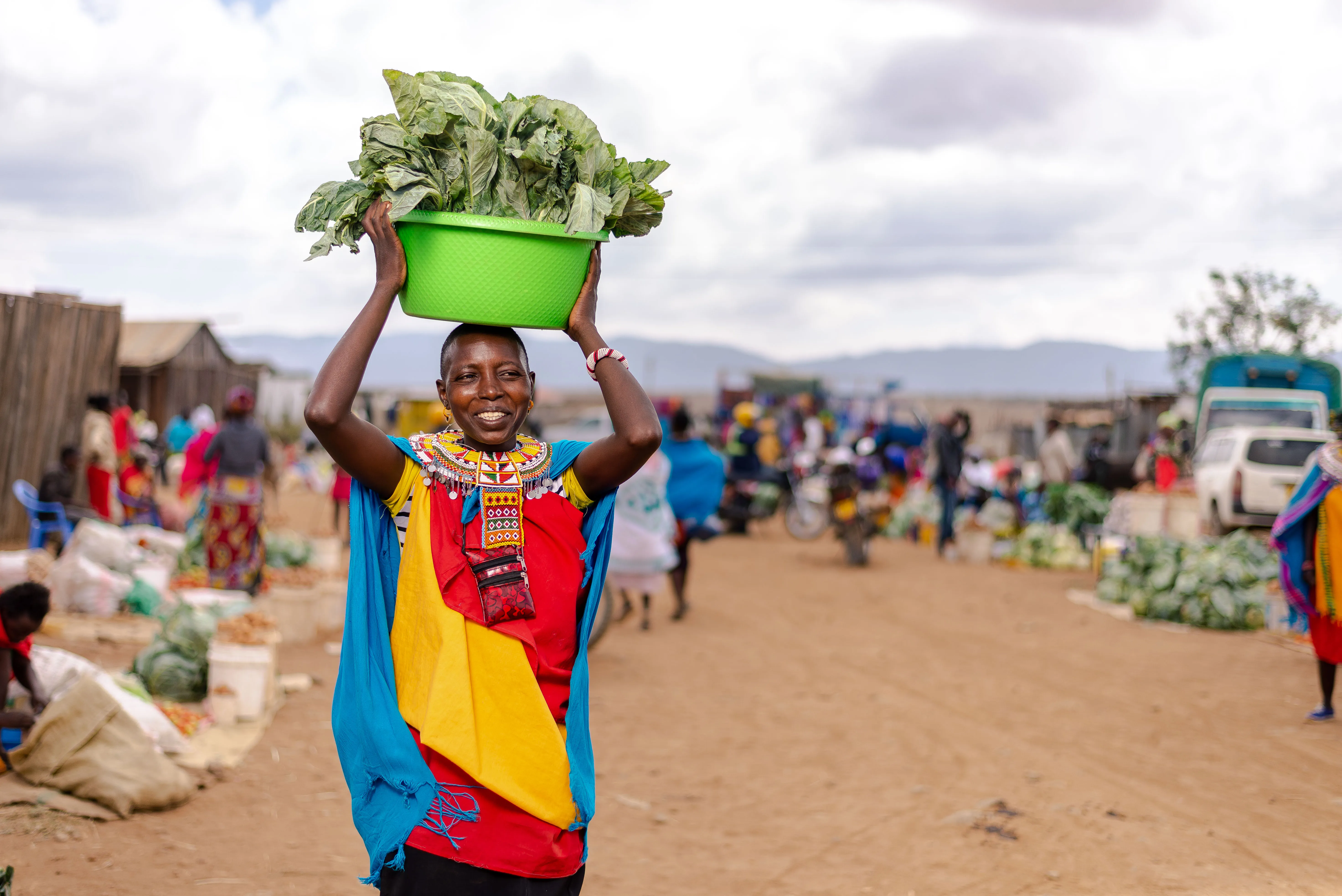 A woman carrying food in samburu kenya 