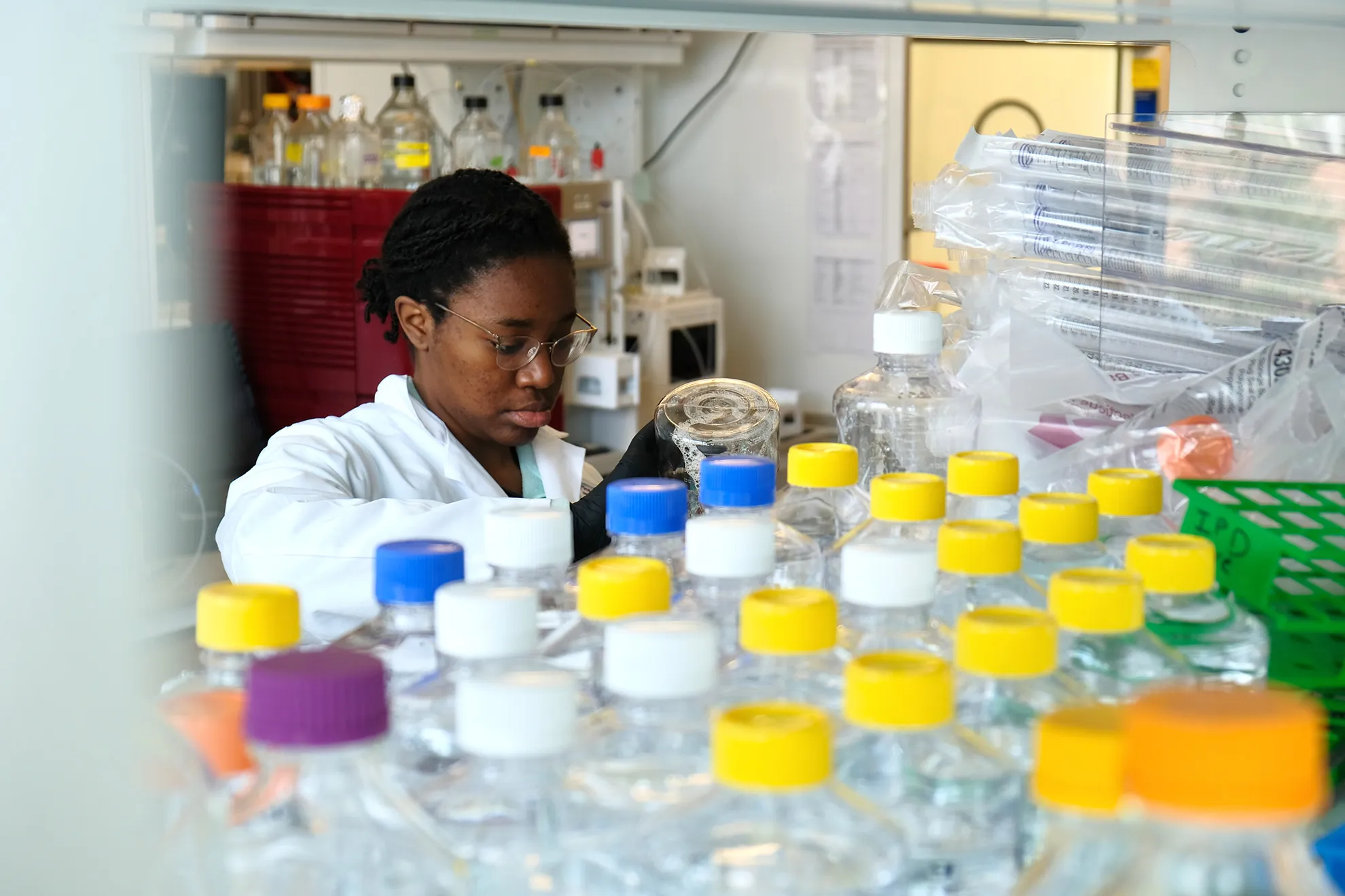 a scientist working in a lab at the institute for protein design 