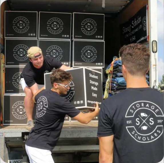 Storage Scholars campus team delivering boxes to a dorm
