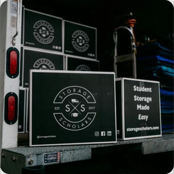 Storage Scholars truck loaded with labeled student storage boxes