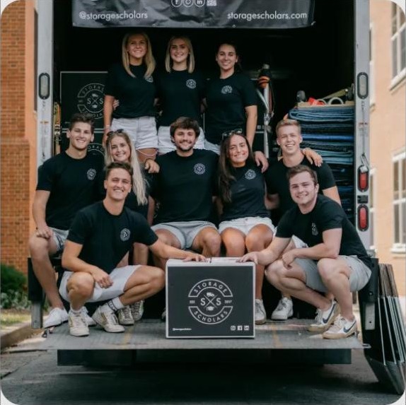 Storage Scholars uniformed movers loading a truck
