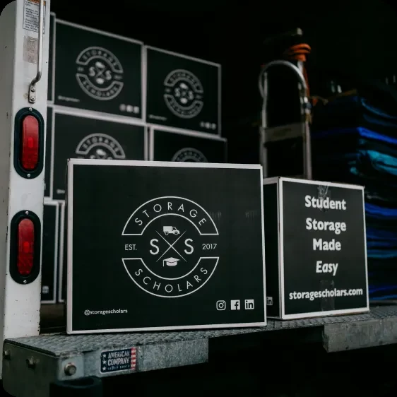 Labeled Storage Scholars boxes stacked inside a truck ready for storage