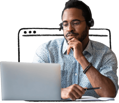 Masculine person wearing a headset and working on a laptop.