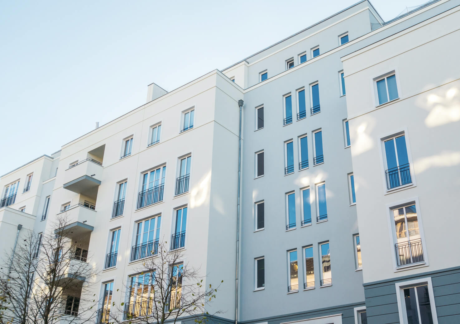 A condo building viewed from the street.