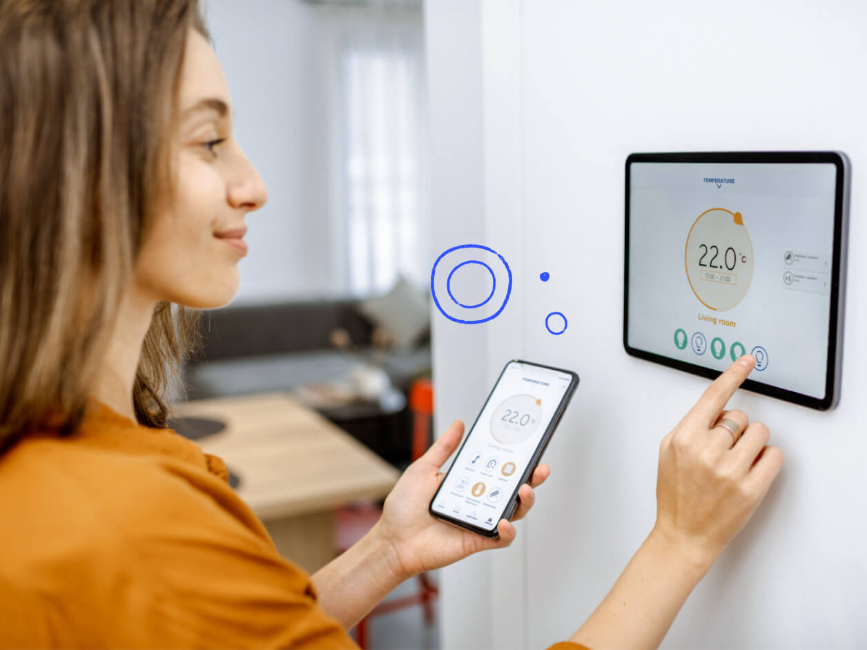 Homeowner using a smart home thermostat.
