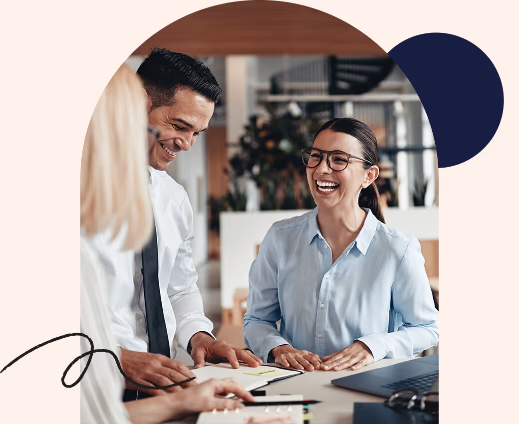 A mother and a daughter sit on the computer together