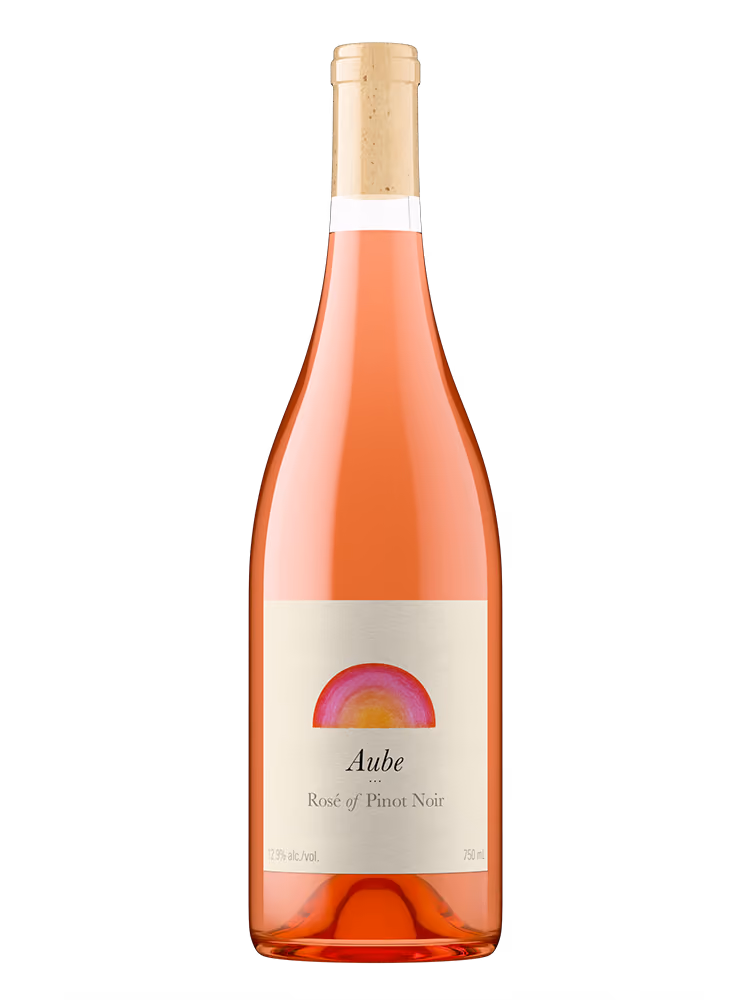 Bottle of Aube Rosé of Pinot Noir wine with a cork and label featuring a pink and orange semi-circle design.
