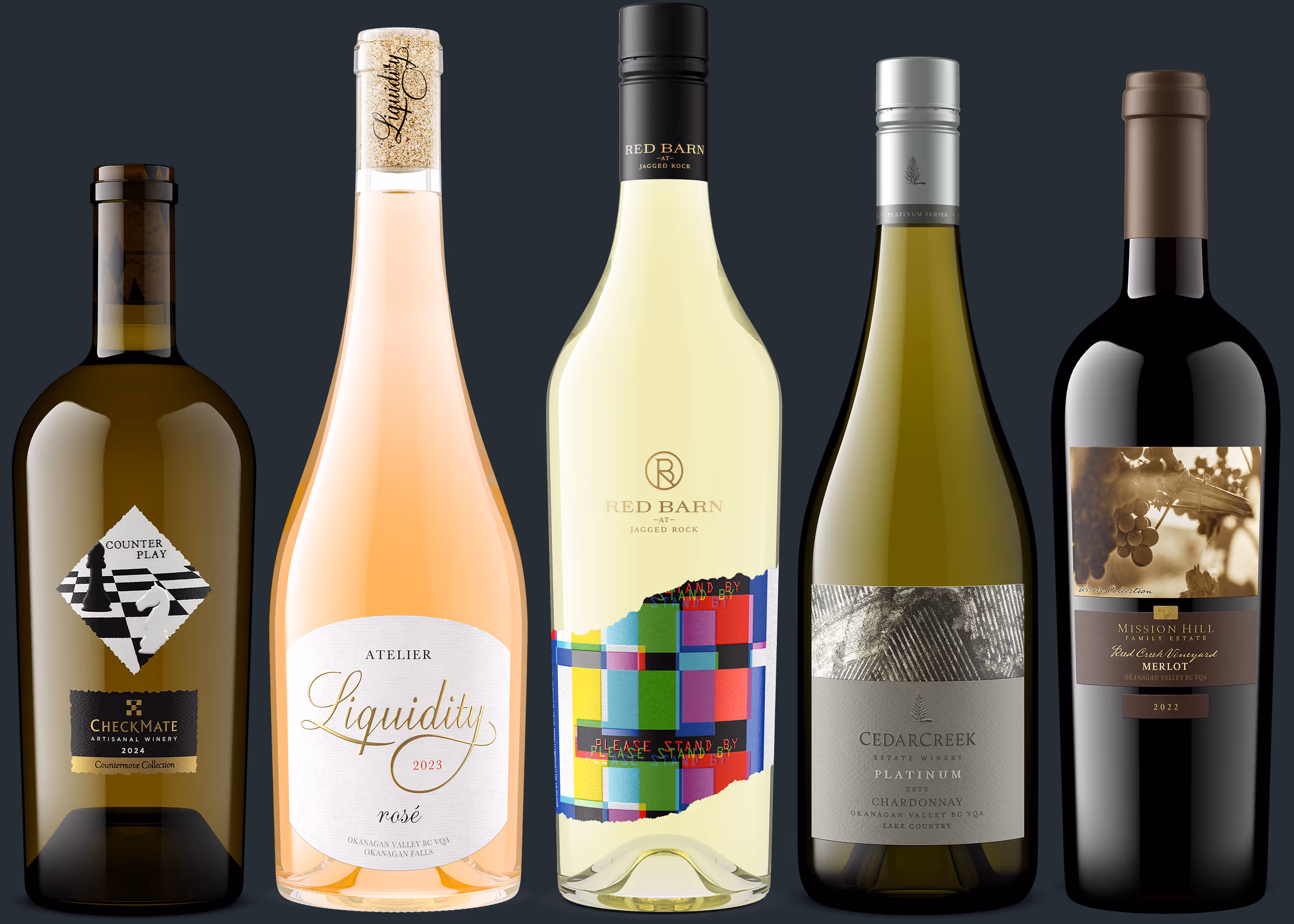 Five wine bottles in a row with diverse labels from various wineries and vintages.