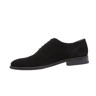 a black shoe with a black background