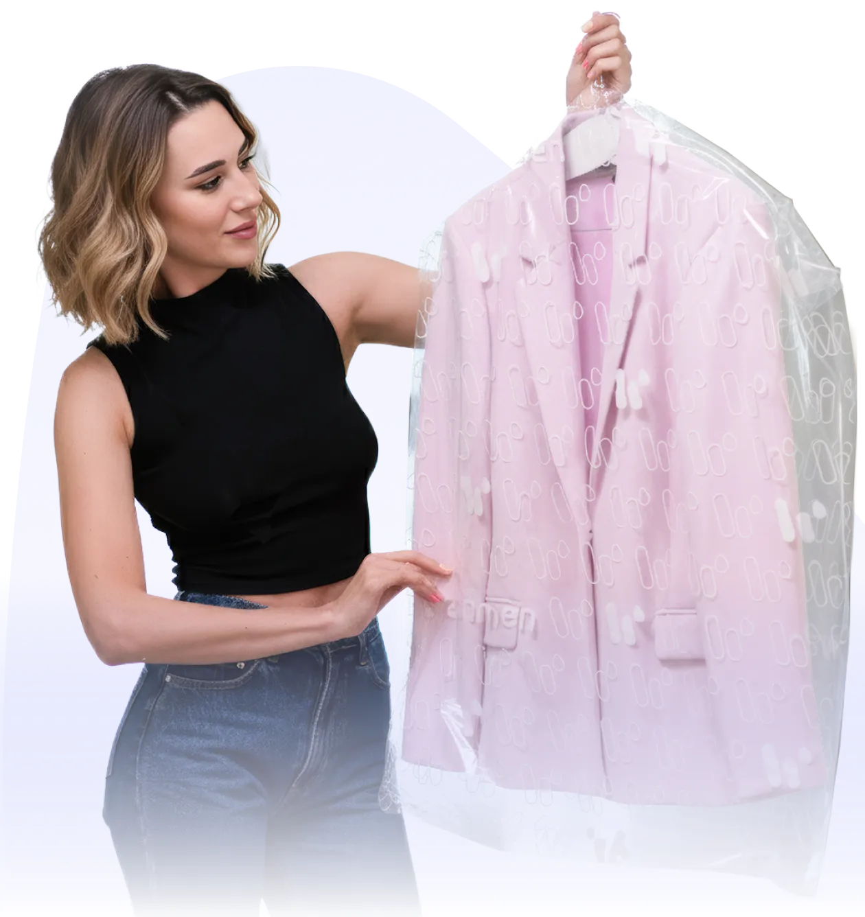 a woman holding a jacket in a plastic bag