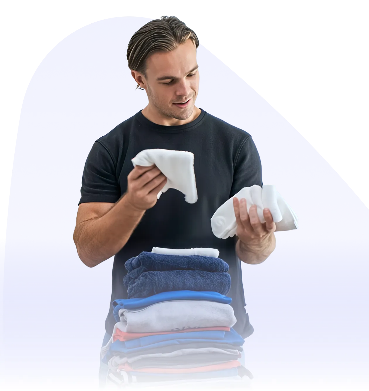 a man holding a stack of towels