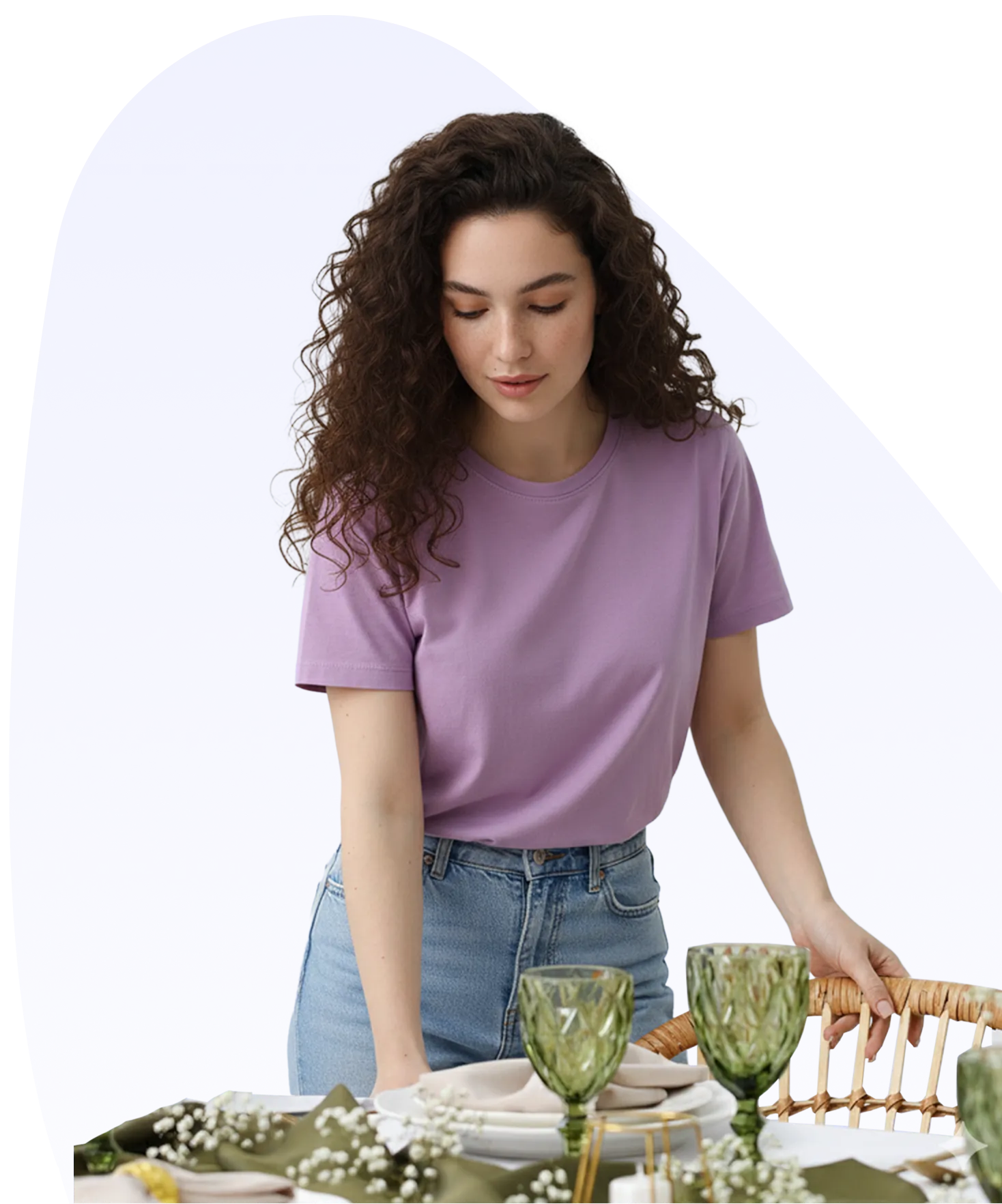 a woman standing next to a table with a basket of dishes