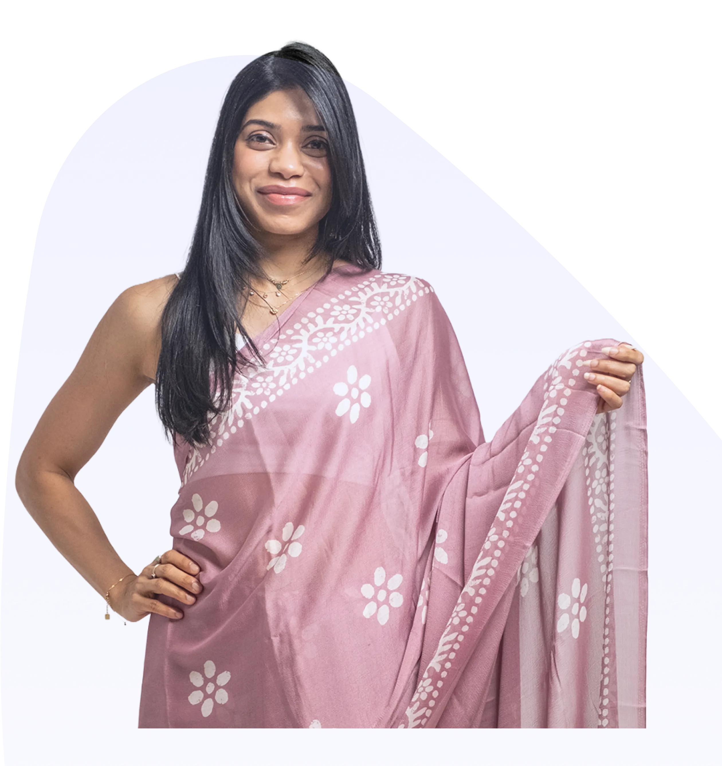 a woman holding a pink sari