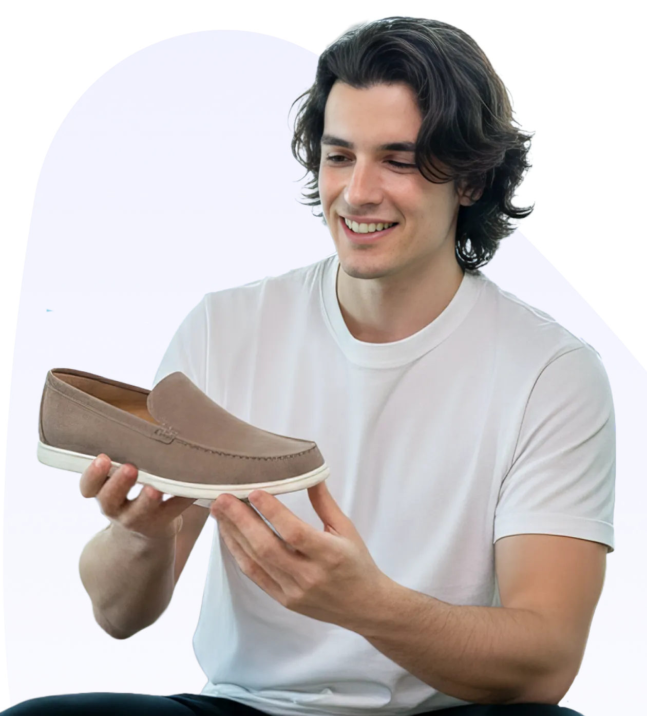 a man holding a shoe