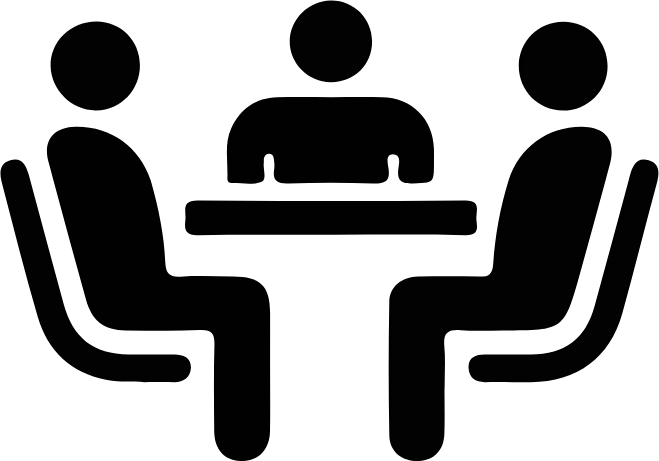 Icon of three people sitting around a table having a meeting.