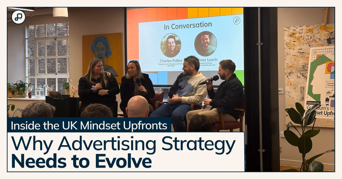 speakers at the event on stage in front of a slide show with a text overlay of the blog title