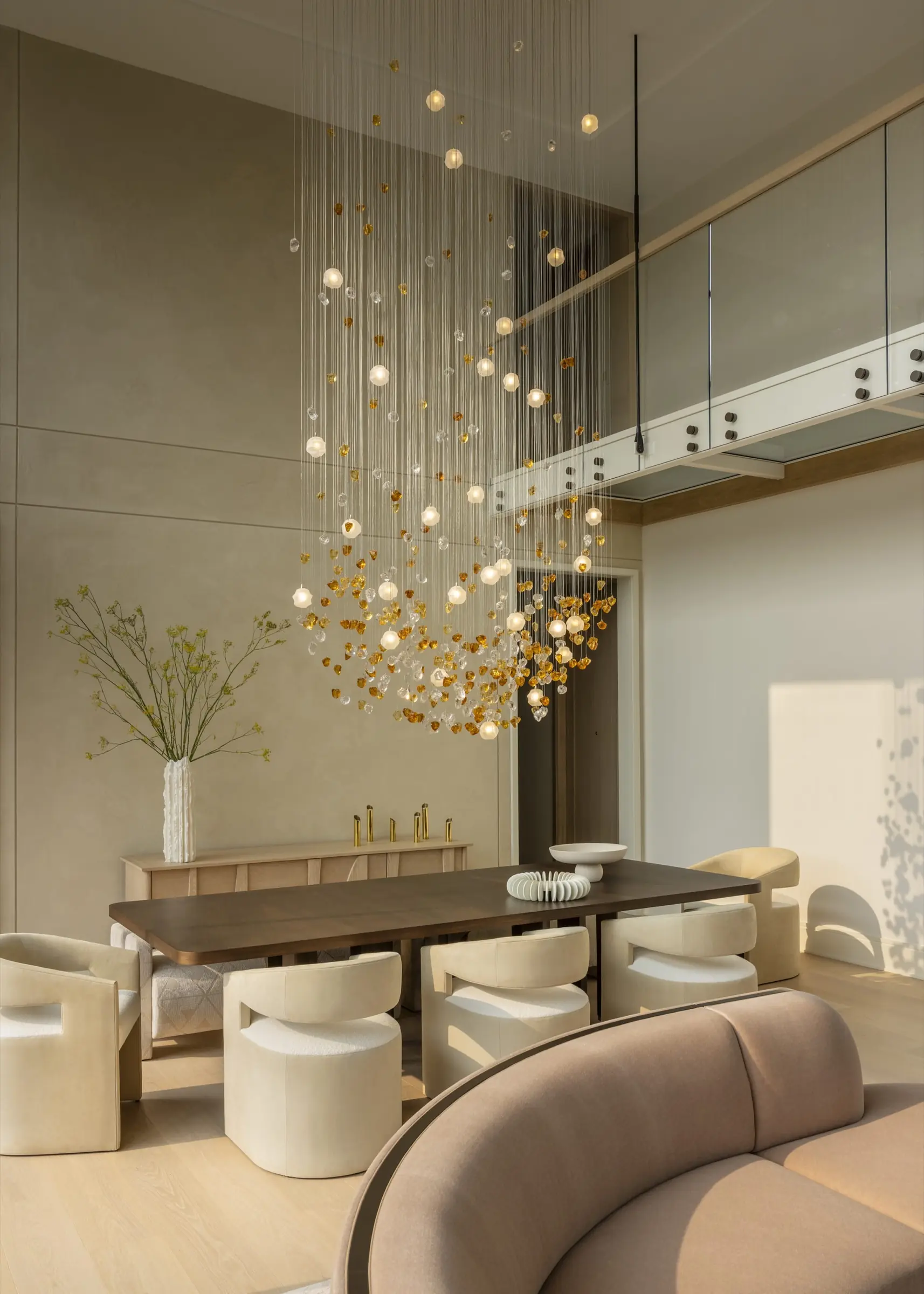 Dining room with commissioned handblown glass orb chandelier