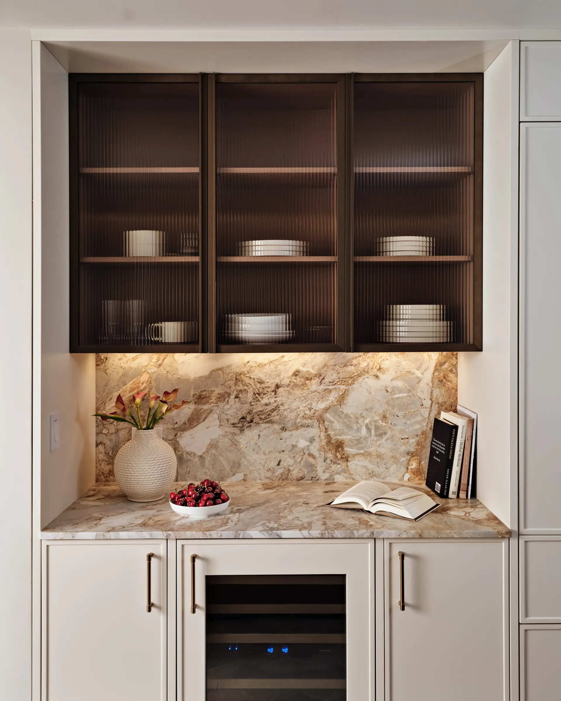 Kitchen shelving with marble backsplash and glassware