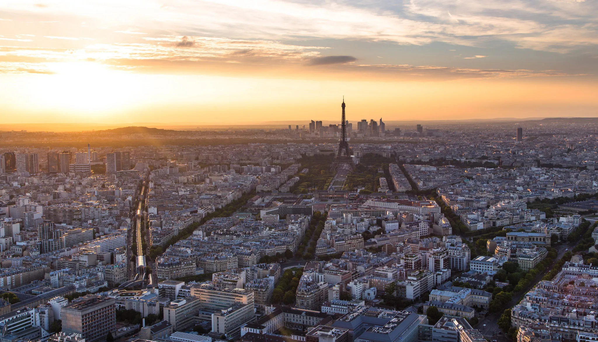 Paris at sunset, with the Eiffel Tower on the horizon
