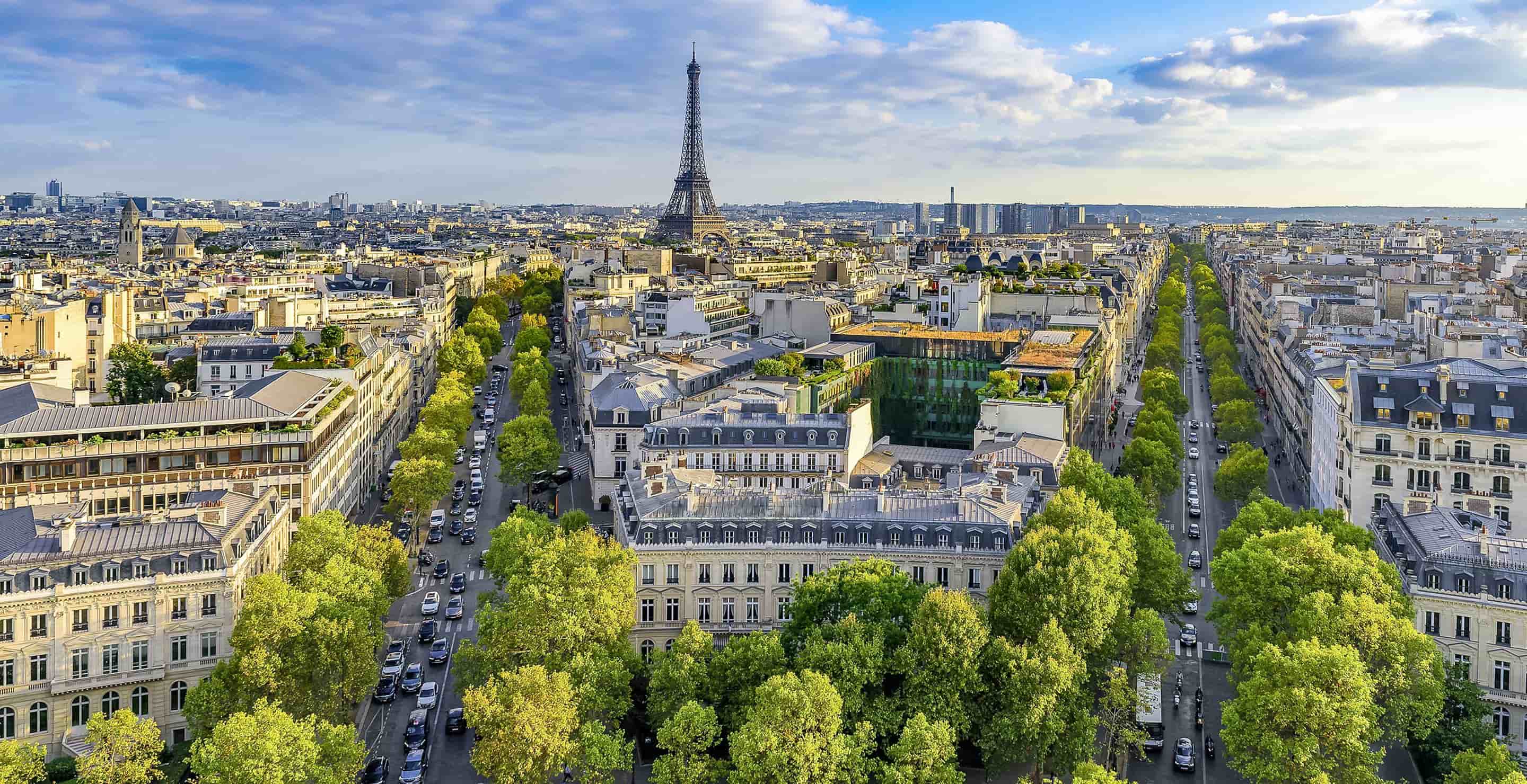 Paris seen from above, the Eiffel Tower on the horizon