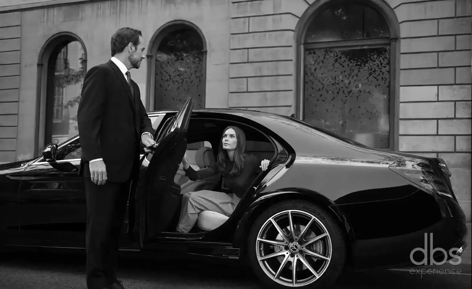 A DBS EXPERIENCE chauffeur welcoming an international client in Paris