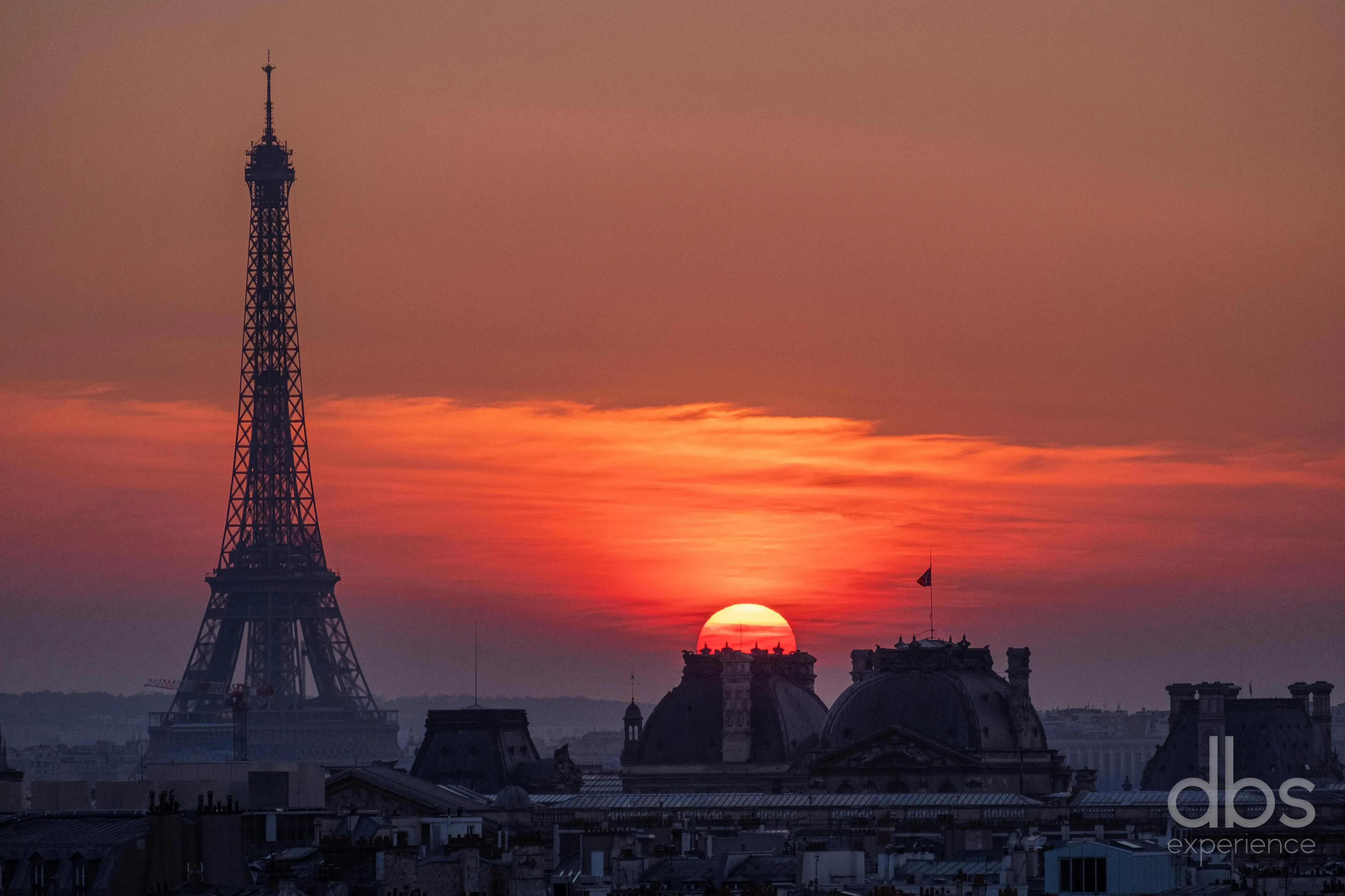 The Eiffel Tower at sunset seen across Paris