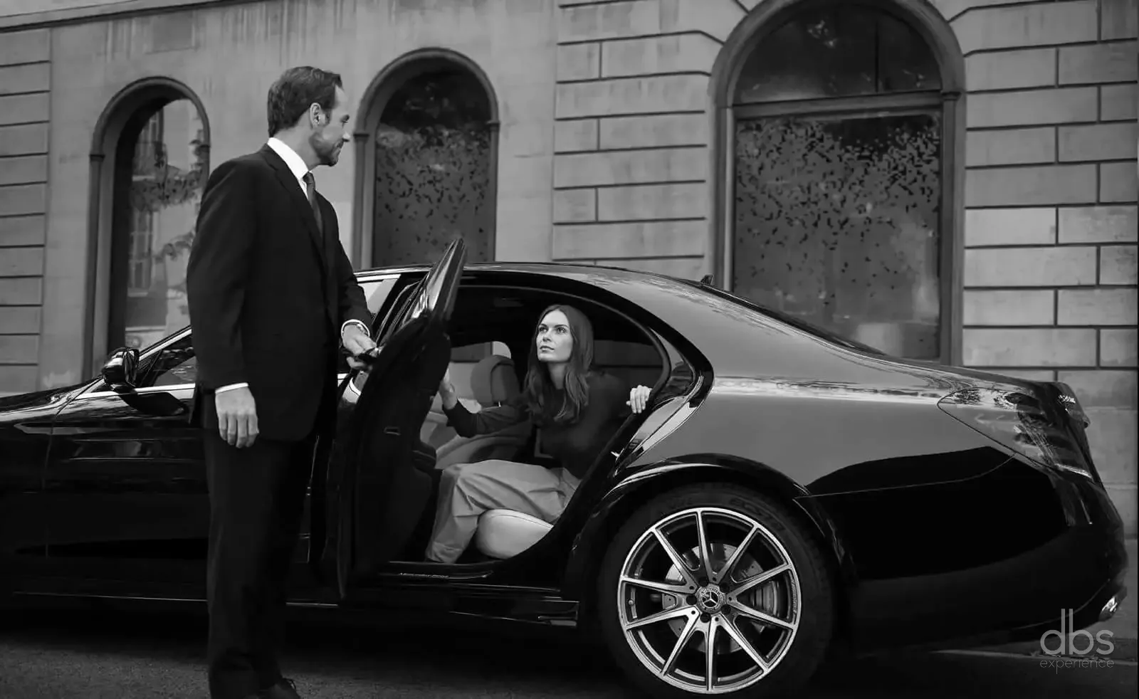 A DBS EXPERIENCE chauffeur welcoming an international client in Paris