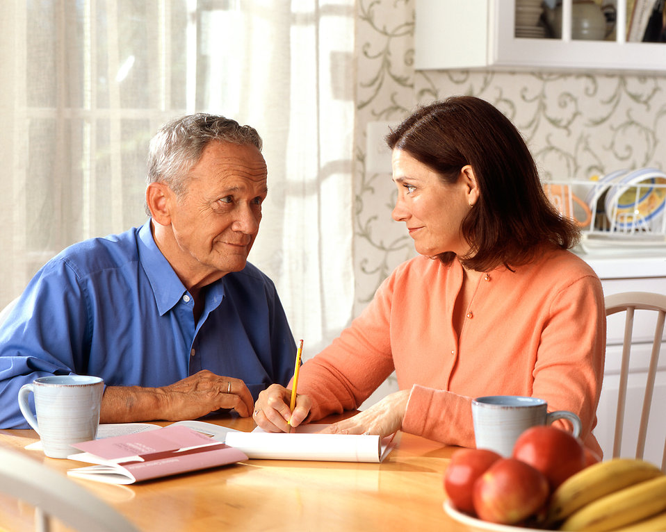 Couple talking at kitchen table