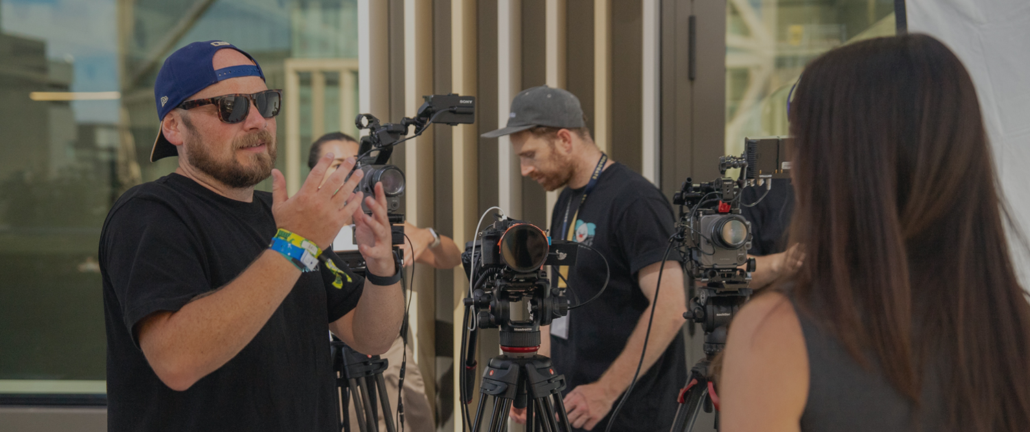 a director speaking to a subject showing a behind the scenes working of a talking head film
