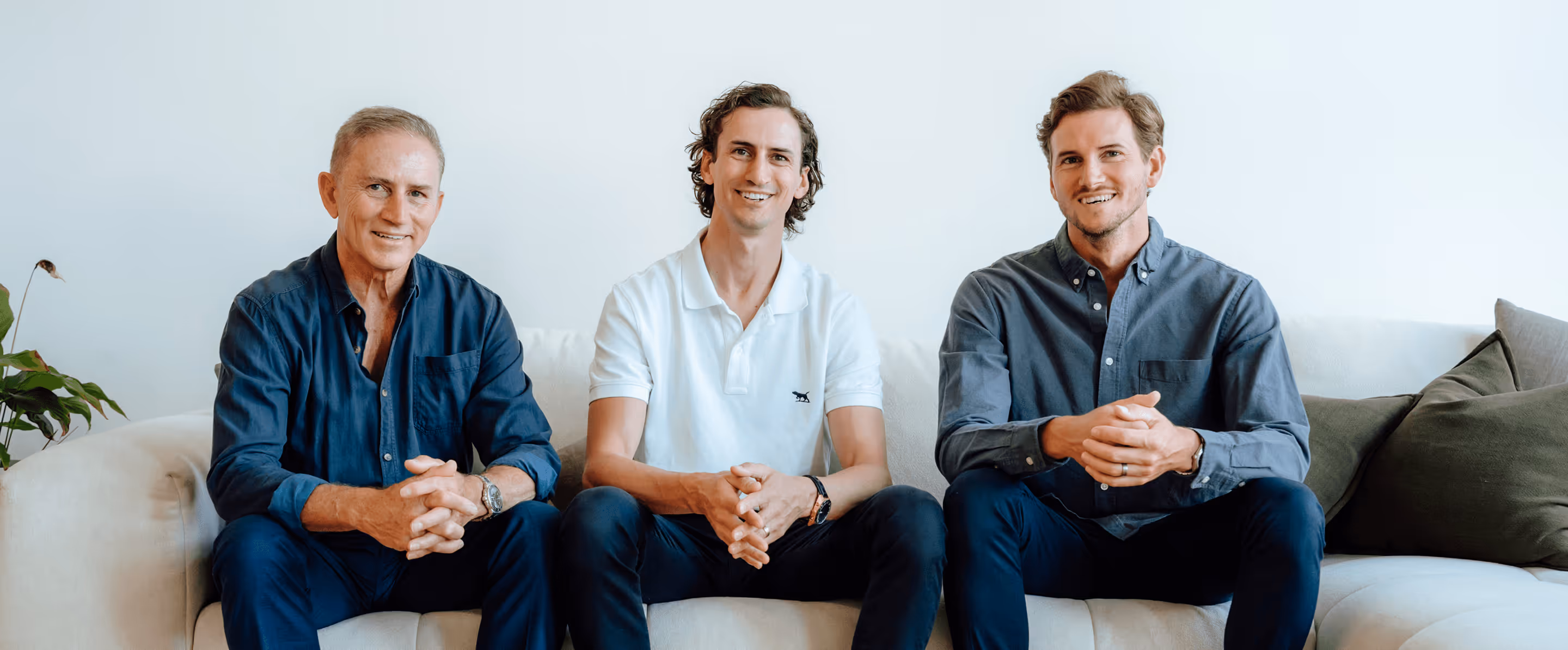 Group of three people smiling