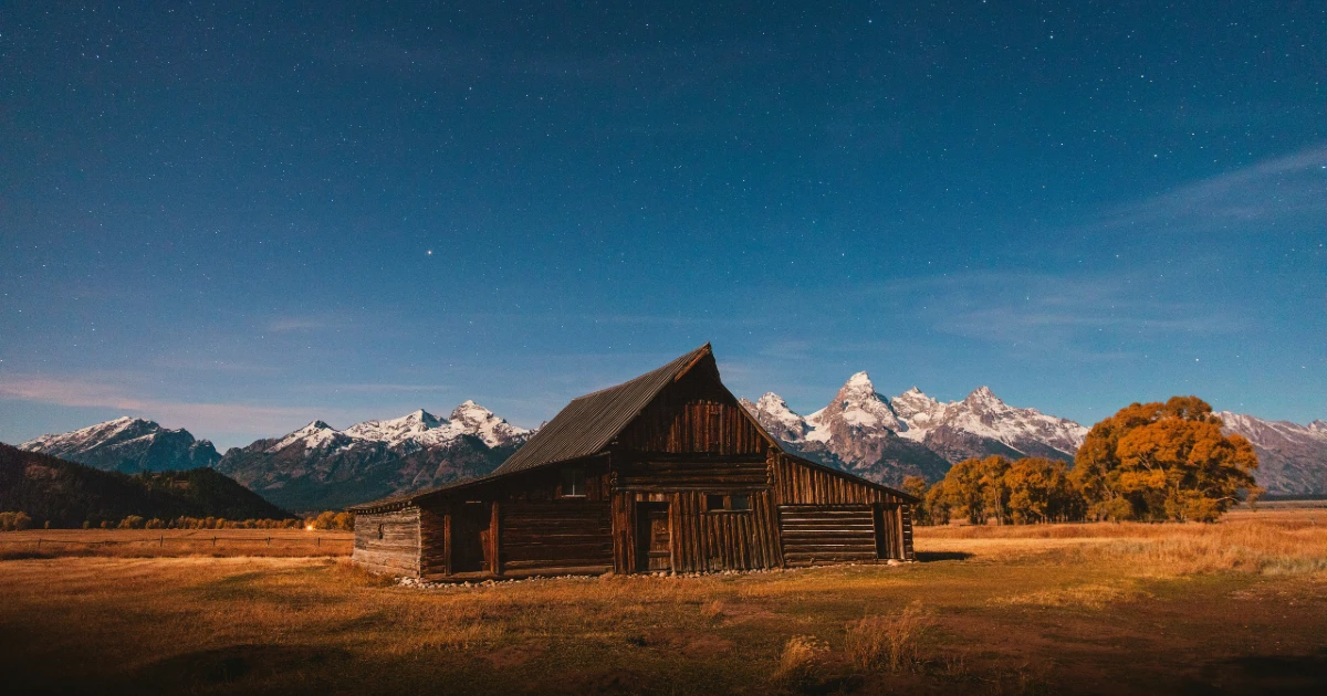A house in Wyoming with a beautiful mountain behind it