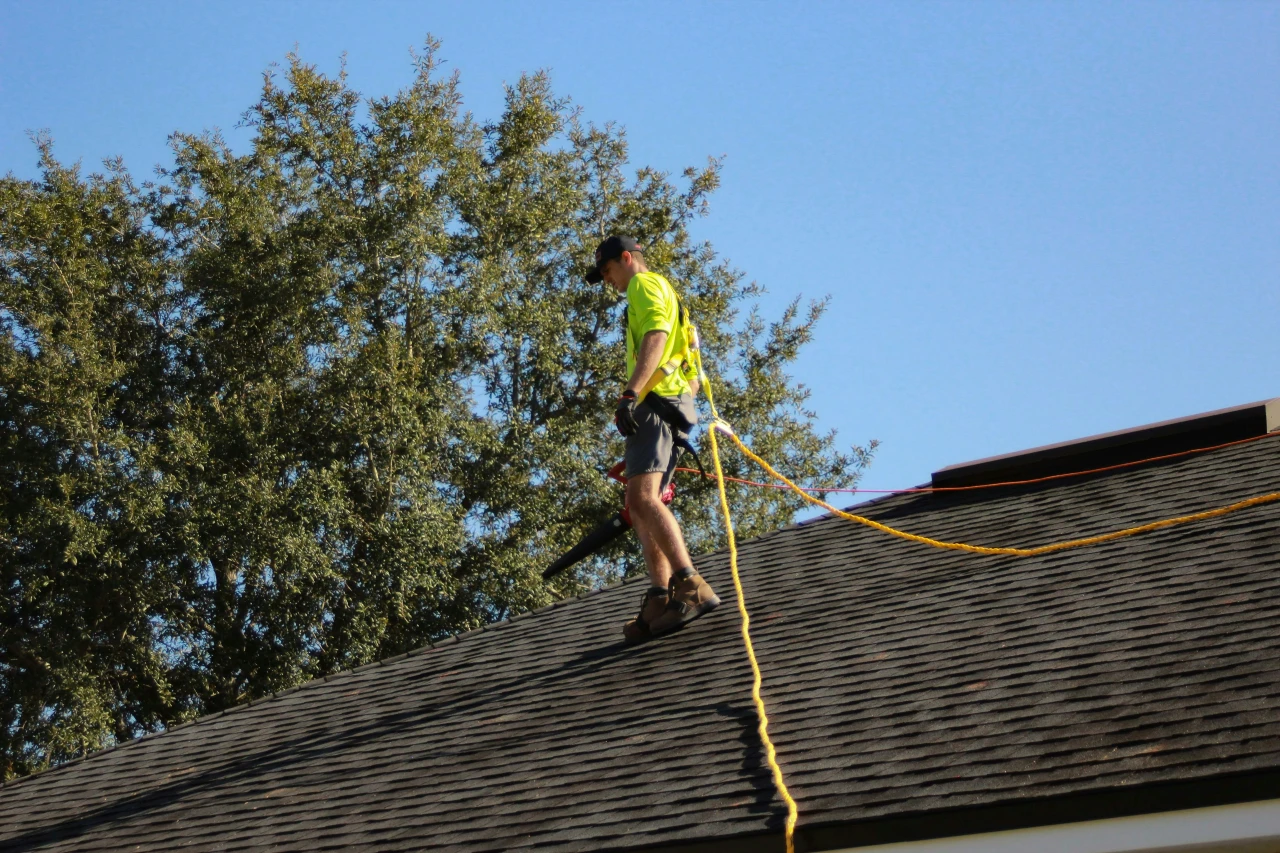A man repairs a roof