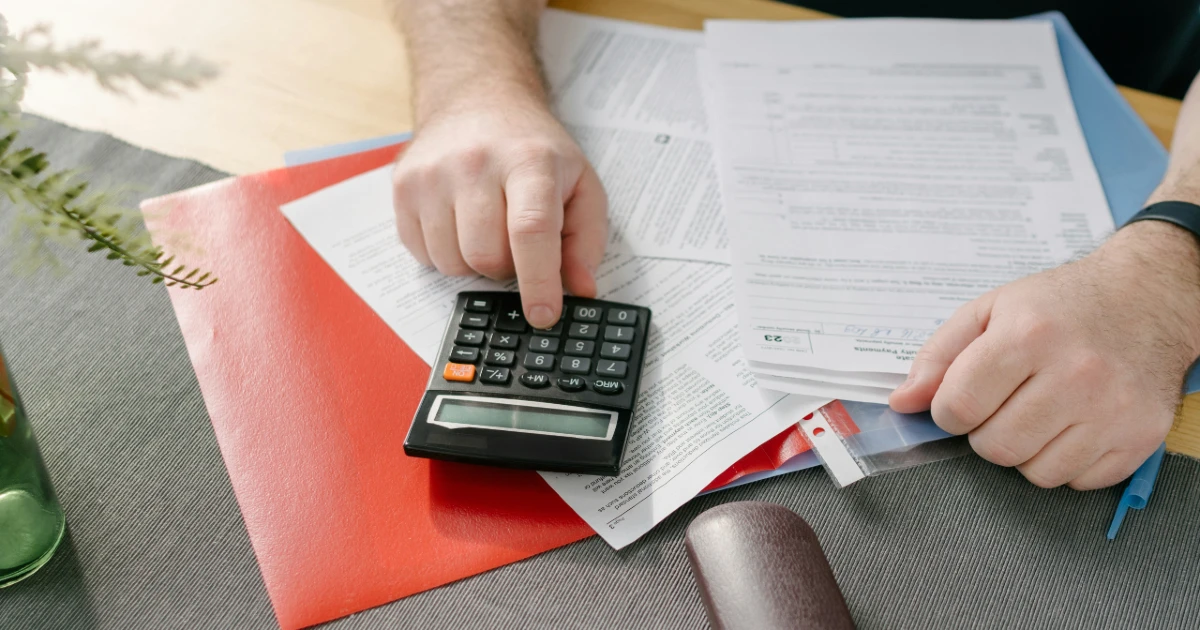A man calculates his taxes for rental income
