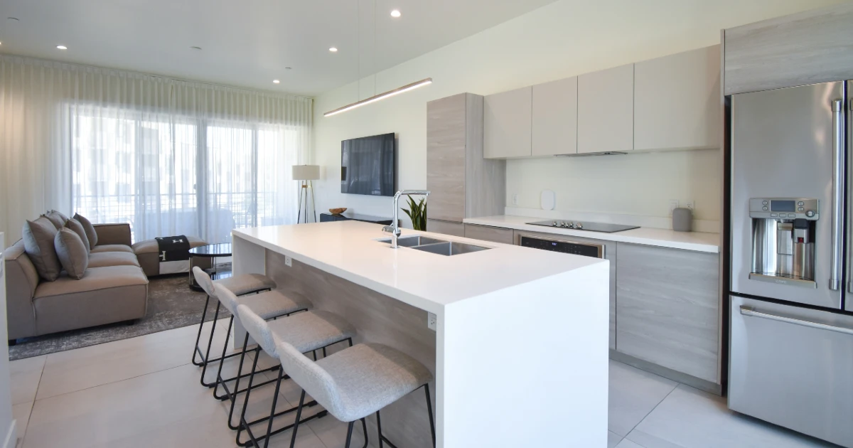 The kitchen and living room interior of an Airbnb