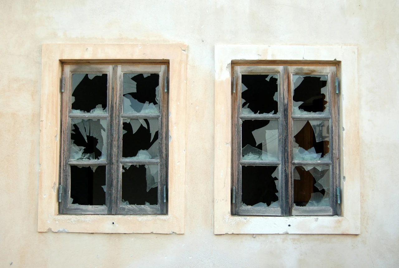 Broken windows at a rental property