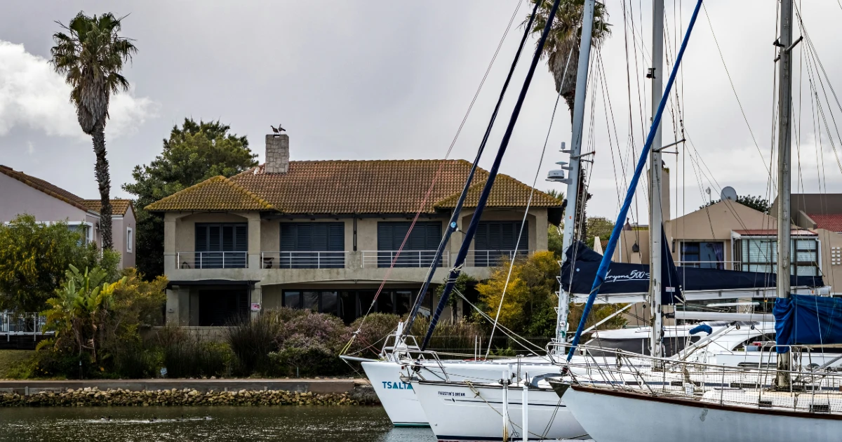 A vacation home on a marina with a boat