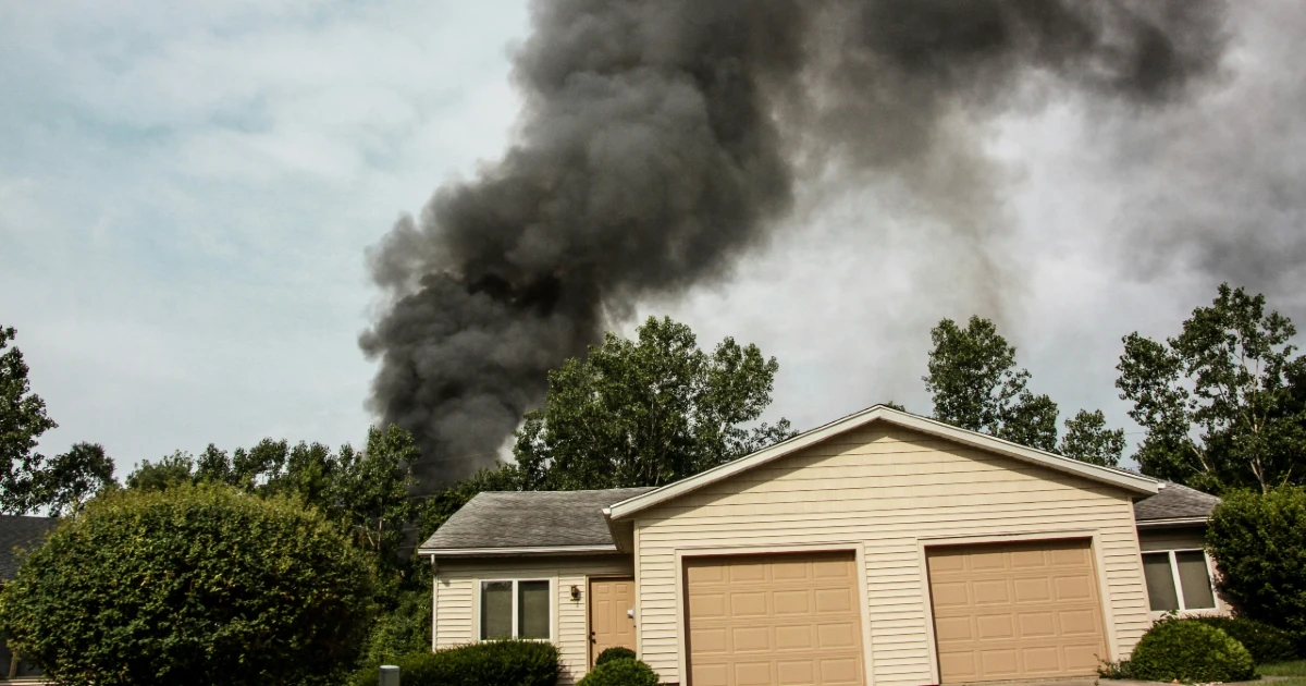 Smoke rises from a house