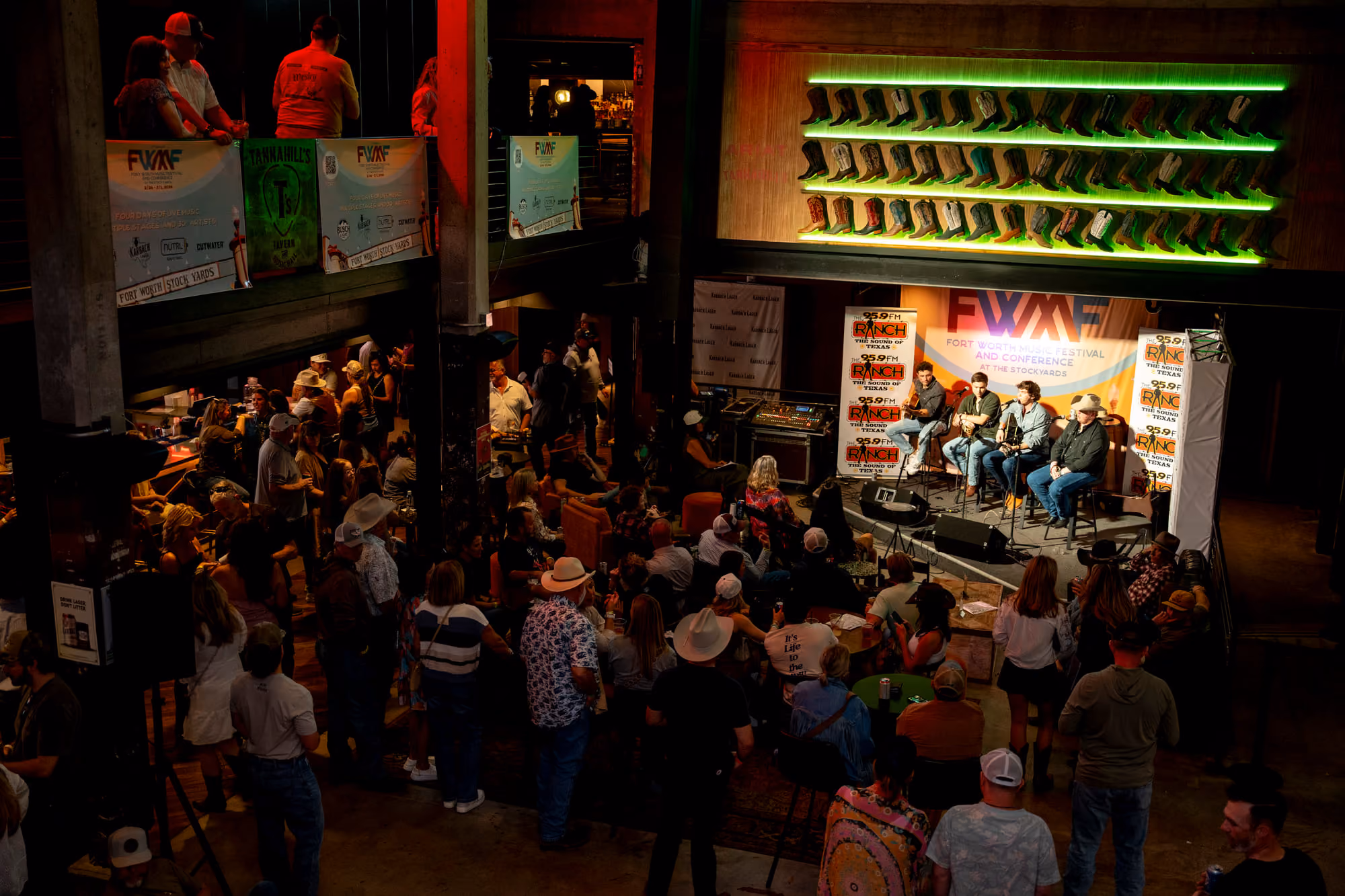 Crowd watching a panel on stage at the Fort Worth Music Festival inside Tannahill's