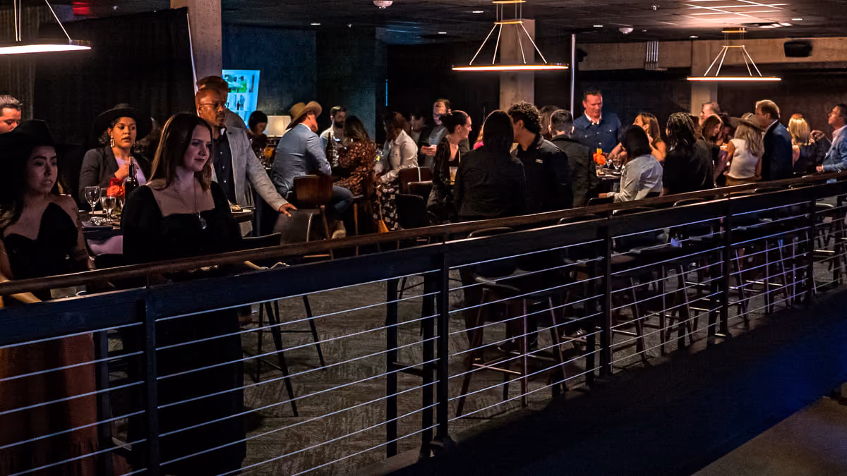 Guests gathered along the rail in Tannahill's Suites overlooking the venue floor